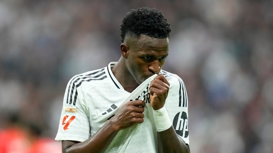 Real Madrid's Vinicius Junior celebrates after scoring his side's fourth goal during the Spanish La Liga soccer match against Osasuna.(AP)